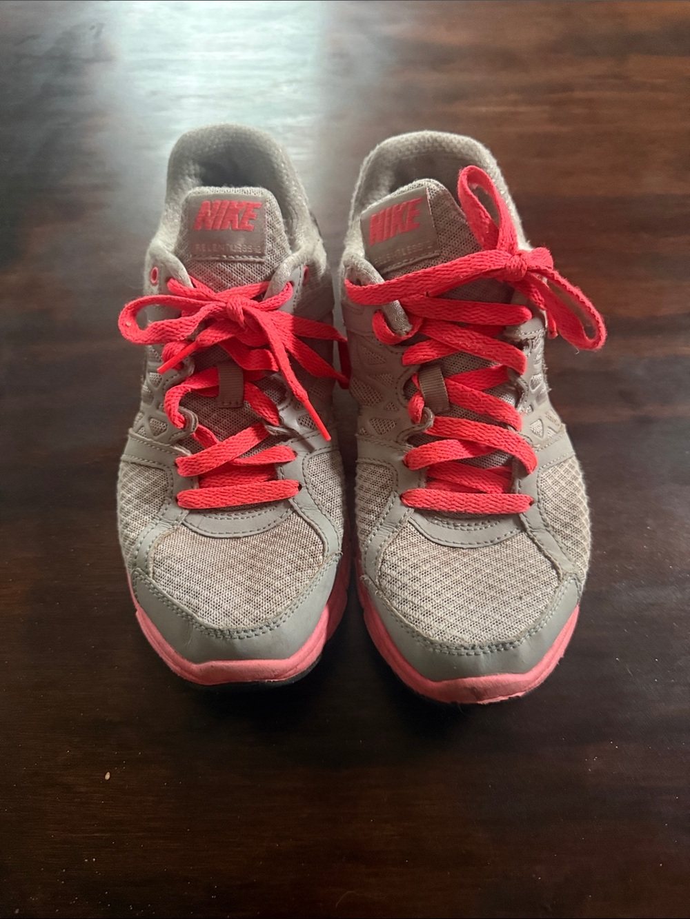 Nike Women's Gray Sneakers with Pink Accents